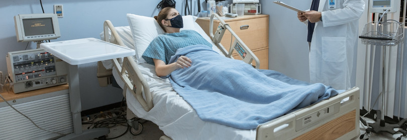 patient in a Houston hospital talking to a doctor