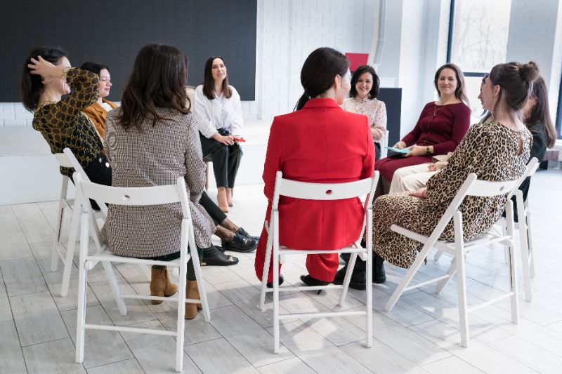support group of female sexual assault survivors talking