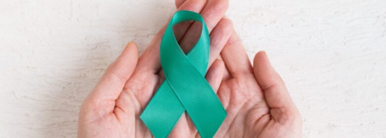 Hands holding a Sexual assault ribbon