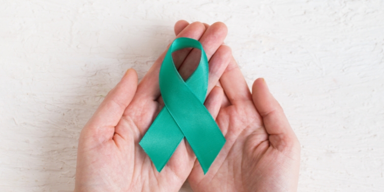 Hands holding a Sexual assault ribbon